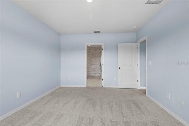 33369 Hamilton Hill Ln, Wesley Chapel, FL 33545 - unfurnished bedroom with carpet and connected bathroom