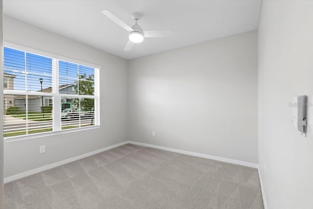 33369 Hamilton Hill Ln, Wesley Chapel, FL 33545 - unfurnished room featuring light carpet and ceiling fan