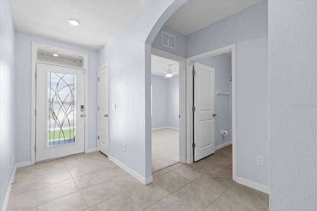 33369 Hamilton Hill Ln, Wesley Chapel, FL 33545 - entryway with arched walkways and light tile patterned floors