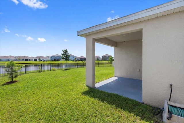 33369 Hamilton Hill Ln, Wesley Chapel, FL 33545 - view of yard featuring a residential view, a water view, and a patio area
