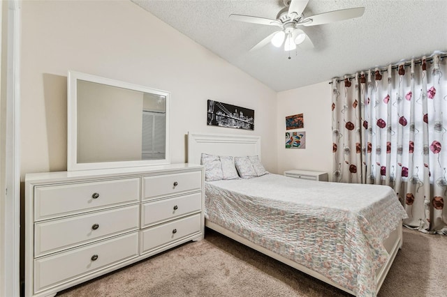 3335 Fox Hunt Dr, Palm Harbor, FL 34683 - bedroom featuring light colored carpet, lofted ceiling, a textured ceiling, and a ceiling fan