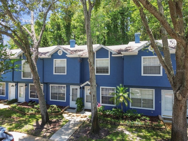 3335 Fox Hunt Dr, Palm Harbor, FL 34683 - multi unit property with a chimney and stucco siding