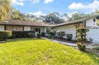 5781 S Utopia Ter, Inverness, FL 34452 - ranch-style house featuring a front lawn