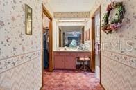 5781 S Utopia Ter, Inverness, FL 34452 - hallway with wallpapered walls