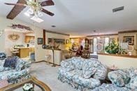 5781 S Utopia Ter, Inverness, FL 34452 - living area with lofted ceiling and a ceiling fan