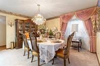 5781 S Utopia Ter, Inverness, FL 34452 - dining area featuring a chandelier and carpet floors