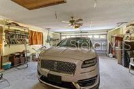 5781 S Utopia Ter, Inverness, FL 34452 - garage featuring ceiling fan