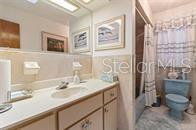 5781 S Utopia Ter, Inverness, FL 34452 - bathroom featuring vanity and shower / bath combination with curtain