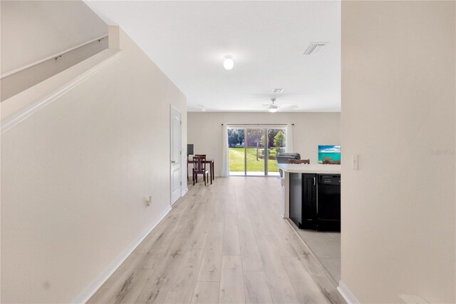 12710 Buffalo Run Dr, Gibsonton, FL 33534 - corridor with light wood-style flooring and baseboards