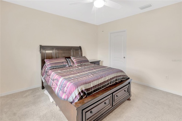 12710 Buffalo Run Dr, Gibsonton, FL 33534 - bedroom with light colored carpet and a ceiling fan