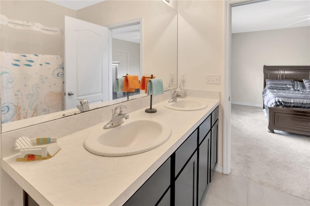 12710 Buffalo Run Dr, Gibsonton, FL 33534 - ensuite bathroom featuring double vanity and tile patterned floors
