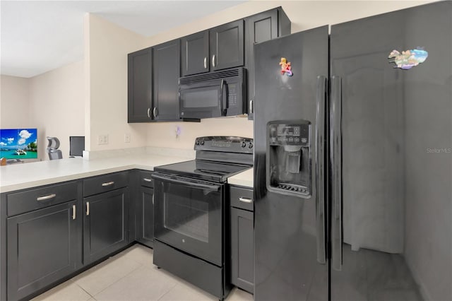 12710 Buffalo Run Dr, Gibsonton, FL 33534 - kitchen featuring black appliances, light countertops, and light tile patterned floors