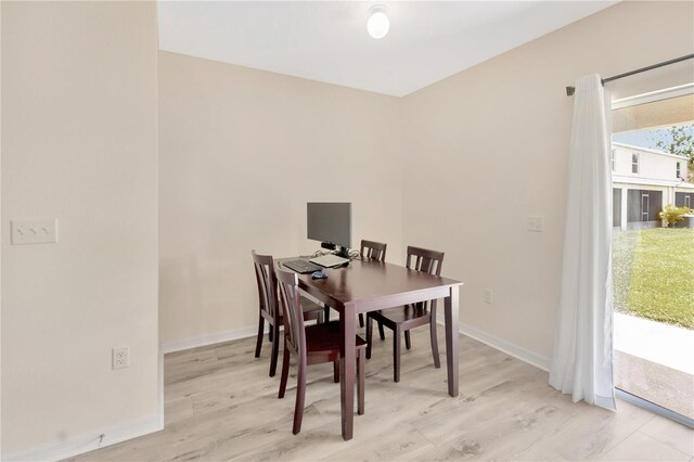 12710 Buffalo Run Dr, Gibsonton, FL 33534 - dining space featuring baseboards and light wood finished floors
