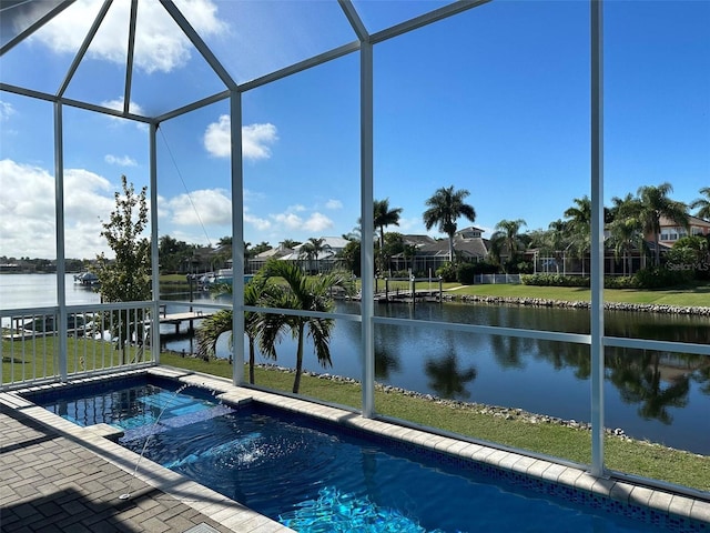 5307 Wishing Arch Dr, Apollo Beach, FL 33572 - view of pool featuring a water view, glass enclosure, a pool with connected hot tub, and a yard