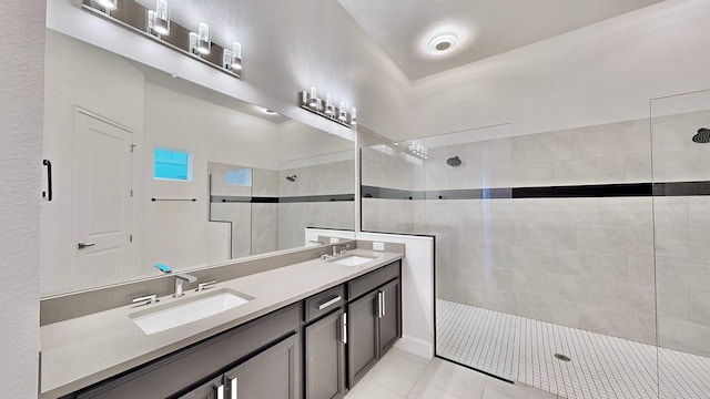 5307 Wishing Arch Dr, Apollo Beach, FL 33572 - bathroom featuring a walk in shower, double vanity, and tile patterned floors