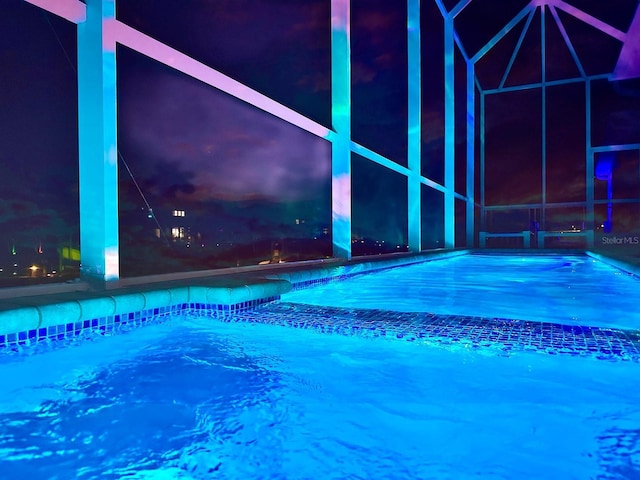 5307 Wishing Arch Dr, Apollo Beach, FL 33572 - pool at night featuring an outdoor pool