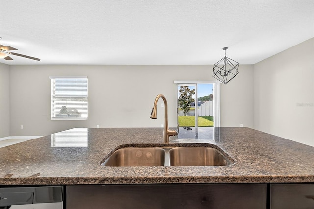 13324 Willow Bluestar Loop, Riverview, FL 33579 - kitchen featuring dark stone counters, dishwasher, ceiling fan, and pendant lighting