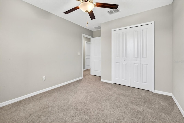 13324 Willow Bluestar Loop, Riverview, FL 33579 - unfurnished bedroom featuring carpet, a closet, and a ceiling fan