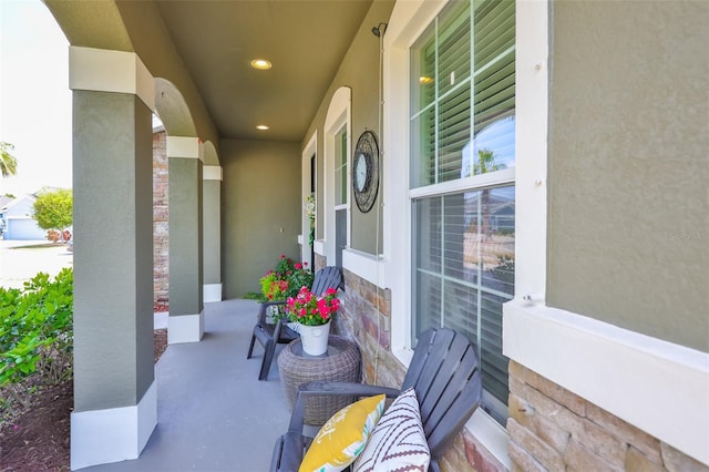 11044 Spring Point Cir, Riverview, FL 33579 - view of exterior entry featuring a porch, stucco siding, and stone siding