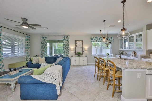 11044 Spring Point Cir, Riverview, FL 33579 - living room with plenty of natural light, light tile patterned flooring, ceiling fan, and recessed lighting