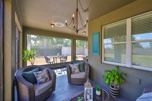 11044 Spring Point Cir, Riverview, FL 33579 - sunroom / solarium featuring a chandelier, outdoor dining space, and an outdoor living space