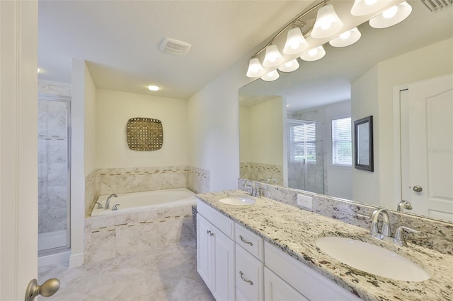 11044 Spring Point Cir, Riverview, FL 33579 - bathroom featuring a shower stall, a garden tub, and double vanity