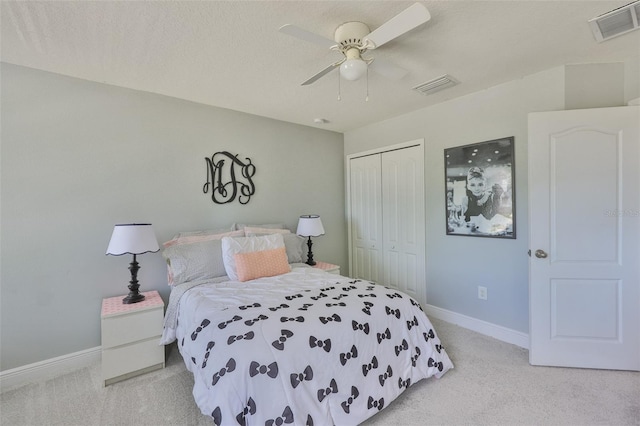 11044 Spring Point Cir, Riverview, FL 33579 - bedroom with light colored carpet, a closet, and ceiling fan