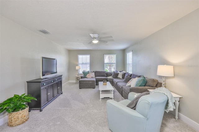 11044 Spring Point Cir, Riverview, FL 33579 - living area featuring a ceiling fan and light carpet