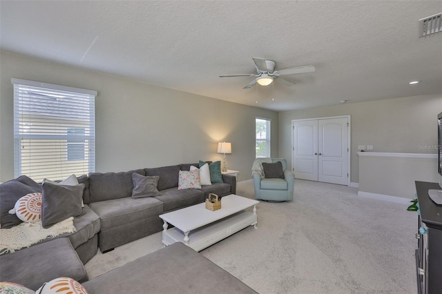 11044 Spring Point Cir, Riverview, FL 33579 - living room with ceiling fan, carpet flooring, and a textured ceiling
