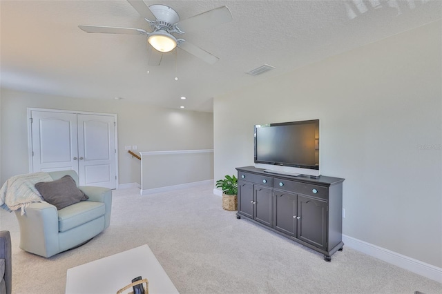 11044 Spring Point Cir, Riverview, FL 33579 - living room featuring light carpet and a ceiling fan