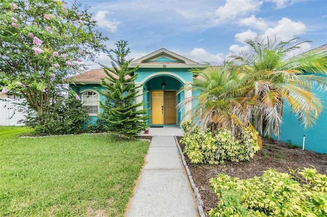 7046 Frascati Loop, Wesley Chapel, FL 33544 - view of front of property featuring a front lawn and stucco siding