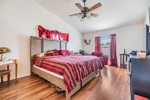 7046 Frascati Loop, Wesley Chapel, FL 33544 - bedroom featuring vaulted ceiling, wood finished floors, and a ceiling fan