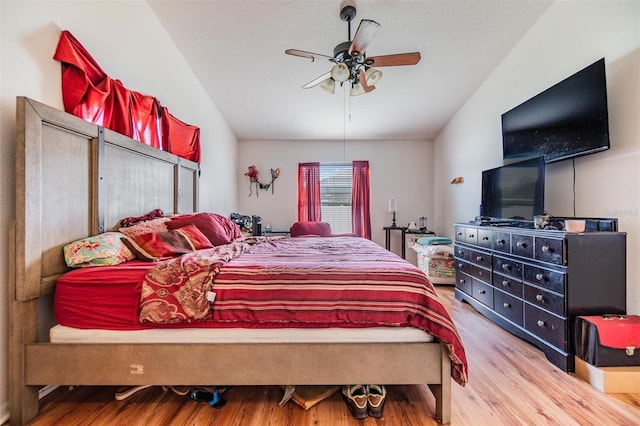 7046 Frascati Loop, Wesley Chapel, FL 33544 - bedroom featuring vaulted ceiling, wood finished floors, and ceiling fan