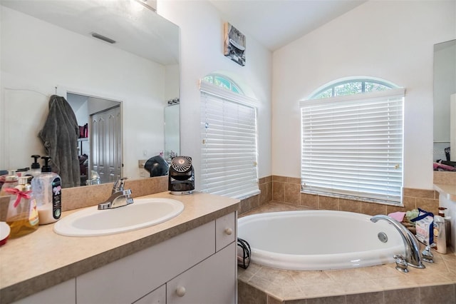 7046 Frascati Loop, Wesley Chapel, FL 33544 - full bath featuring vanity and a garden tub