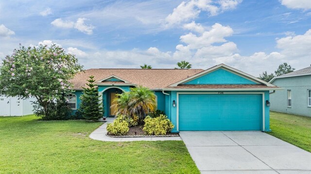 7046 Frascati Loop, Wesley Chapel, FL 33544 - ranch-style house with concrete driveway, an attached garage, a front yard, a shingled roof, and stucco siding