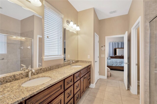 320 Roxbury Crossing Ct, Valrico, FL 33594 - bathroom featuring double vanity, a shower stall, ensuite bath, and tile patterned flooring