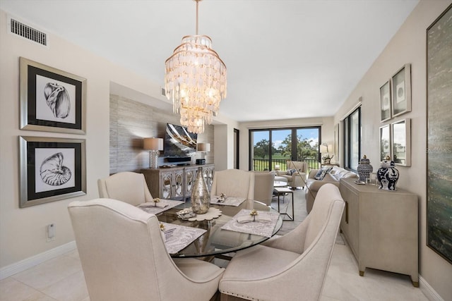 4 Belleview Blvd Unit 305, Belleair, FL 33756 - dining room with a chandelier and tile patterned floors