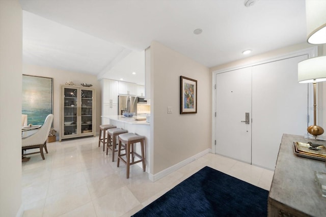 4 Belleview Blvd Unit 305, Belleair, FL 33756 - entryway with light tile patterned floors and recessed lighting
