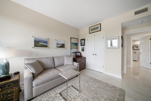 4 Belleview Blvd Unit 305, Belleair, FL 33756 - living room with light tile patterned floors and baseboards
