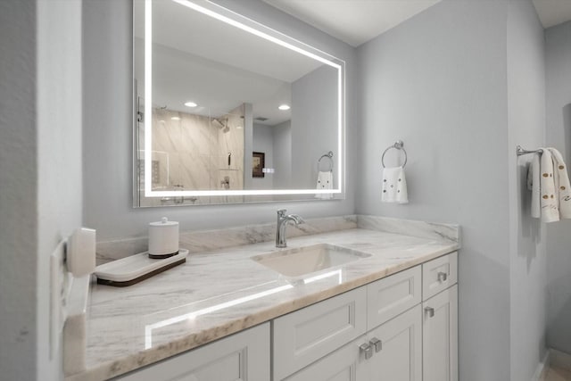4 Belleview Blvd Unit 305, Belleair, FL 33756 - bathroom with vanity, a shower, and recessed lighting