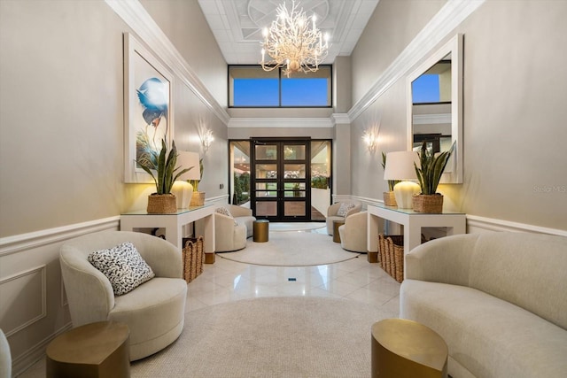 4 Belleview Blvd Unit 305, Belleair, FL 33756 - building lobby featuring a decorative wall, a wainscoted wall, and a towering ceiling