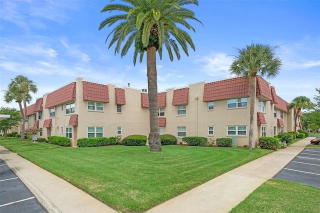 10033 64th Ave N Unit 4, Saint Petersburg, FL 33708 - view of property with uncovered parking and a residential view