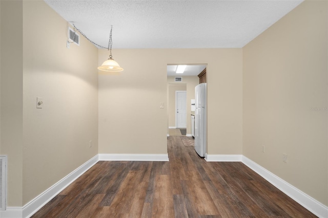 10033 64th Ave N Unit 4, Saint Petersburg, FL 33708 - spare room with dark wood-type flooring and baseboards