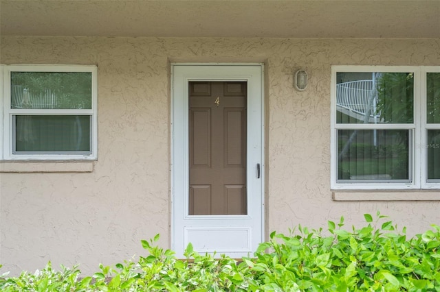 10033 64th Ave N Unit 4, Saint Petersburg, FL 33708 - entrance to property with stucco siding