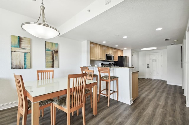 11605 Gulf Blvd Unit 402, Saint Petersburg, FL 33706 - dining room with dark wood-style floors and recessed lighting