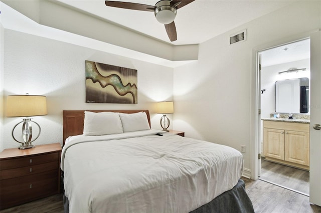 11605 Gulf Blvd Unit 402, Saint Petersburg, FL 33706 - bedroom with wood finished floors and connected bathroom