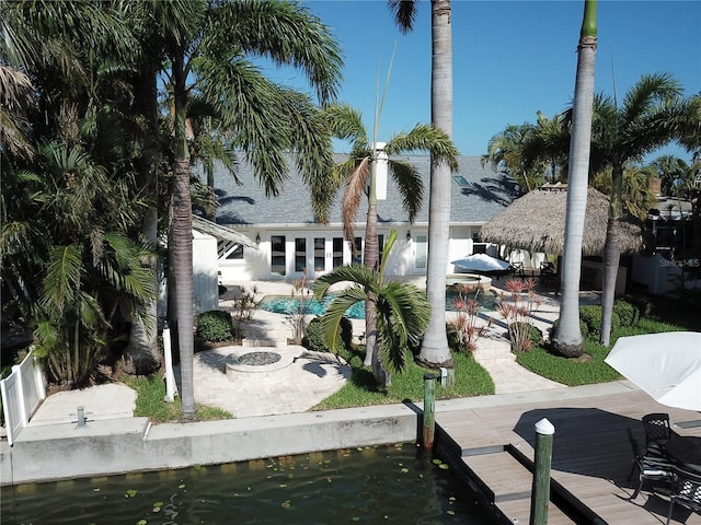 1837 Venetian Point Dr, Clearwater, FL 33755 - dock area with an outdoor pool and a patio