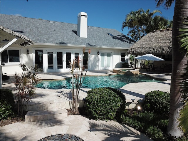 1837 Venetian Point Dr, Clearwater, FL 33755 - view of swimming pool featuring french doors, a patio, and a pool with connected hot tub