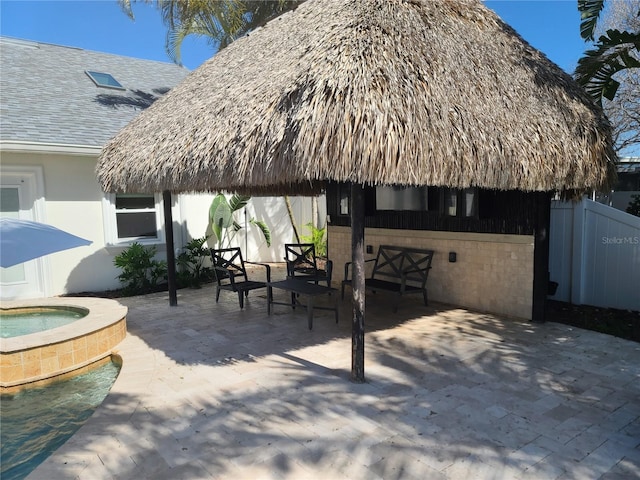 1837 Venetian Point Dr, Clearwater, FL 33755 - view of patio with an in-ground hot tub