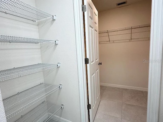 1737 N Lakewood Ave, Ocoee, FL 34761 - walk in closet with tile patterned floors